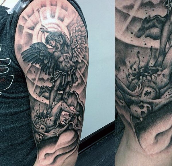 Detailed black and gray angel tattoo with wings and sword battling a monstrous figure