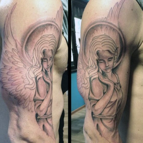 Tattoo of angel with wings and halo covering upper arm