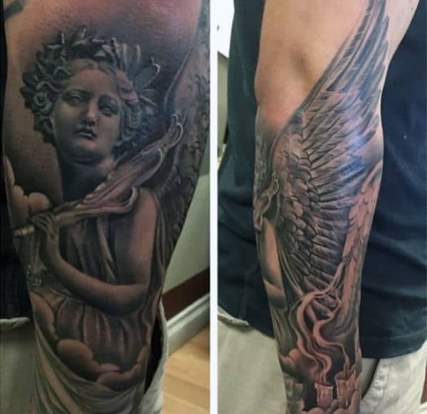 Tattoo of an angel with wings and clouds on a person's upper arm