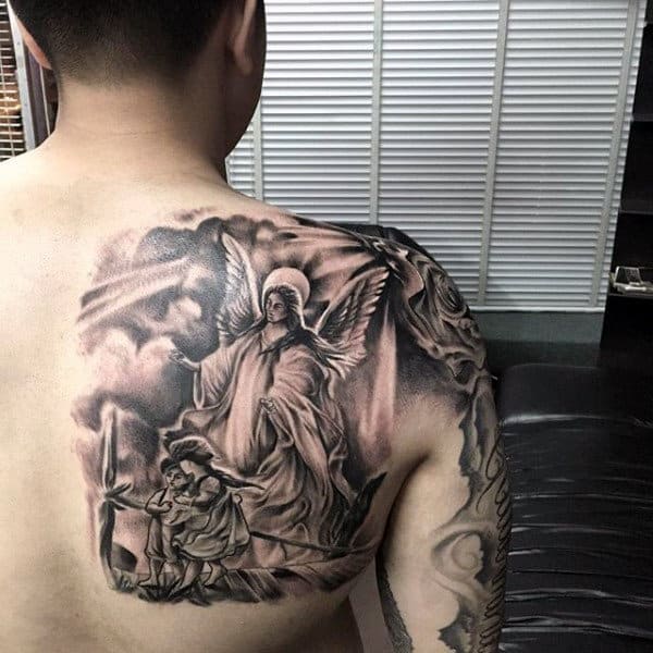 Man with a detailed angel and child tattoo on his back and shoulder