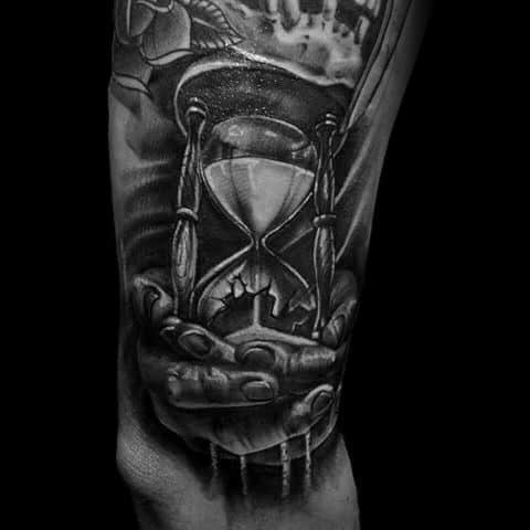 Mens Arm Broken Hourglass With Hands Holding Falling Sand Tattoo