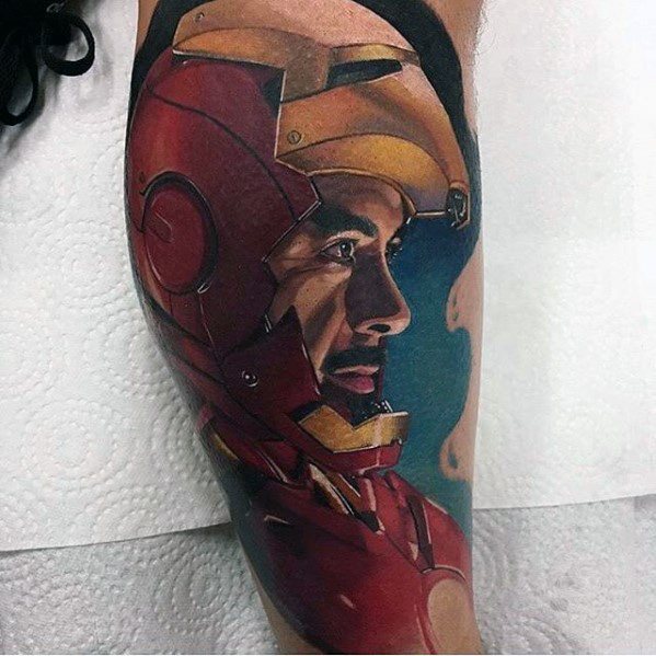 Iron Man tattoo featuring a detailed side profile of Tony Stark in his helmet, with vibrant colors and shading to capture his thoughtful expression and iconic armor.