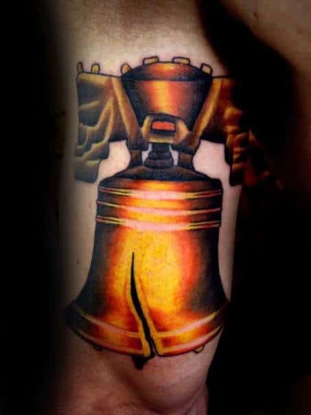Mens Back Of Arm Gold Liberty Bell Tattoo Inspiration