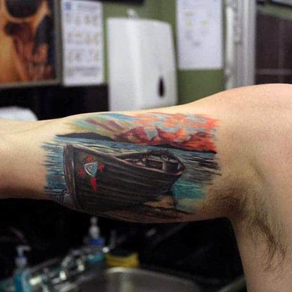 Mens Bicep Piece Tattoo Of Boat On A Lake At Sunset