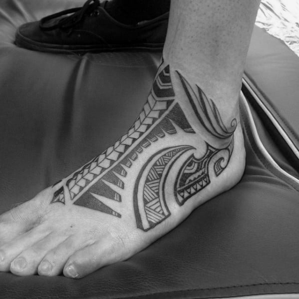 Mens Black Ink Foot Hawaiian Tattoo With Tribal Design