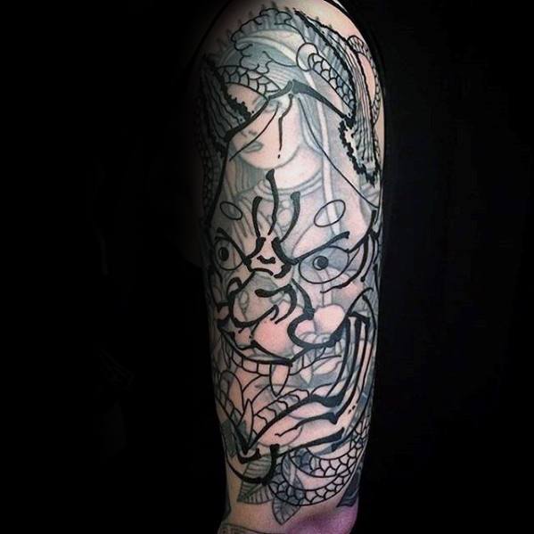 Arm tattoo with a detailed Blast Over Japanese mask design