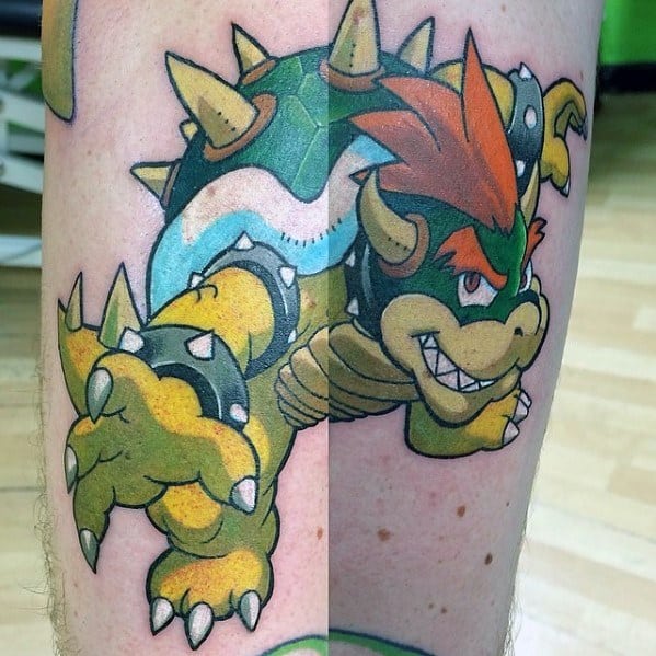 Bold Bowser tattoo on a man's leg featuring sharp outlines, vibrant colors, and a dynamic pose, capturing his fierce and powerful presence.