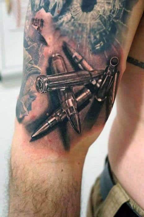Realistic tattoo of scattered bullets with a shattered glass background, combining vivid detail and bold shading for a powerful impact.