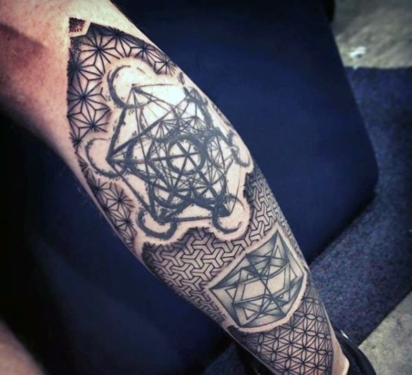 Geometric calf tattoo featuring intricate sacred geometry patterns, interconnected lines, and dotwork shading for a modern abstract look