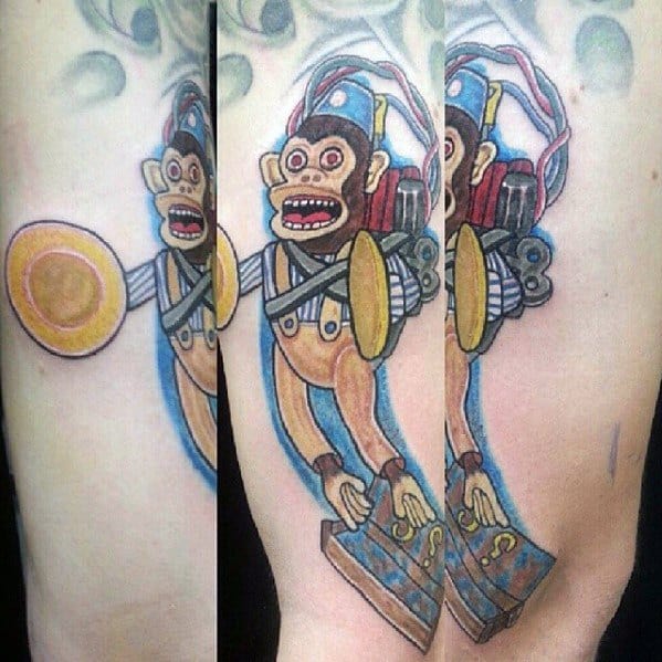Vibrant Call of Duty Monkey Bomb tattoo featuring bright colors, detailed cymbals, and a dynamic pose, capturing the explosive in-game icon.