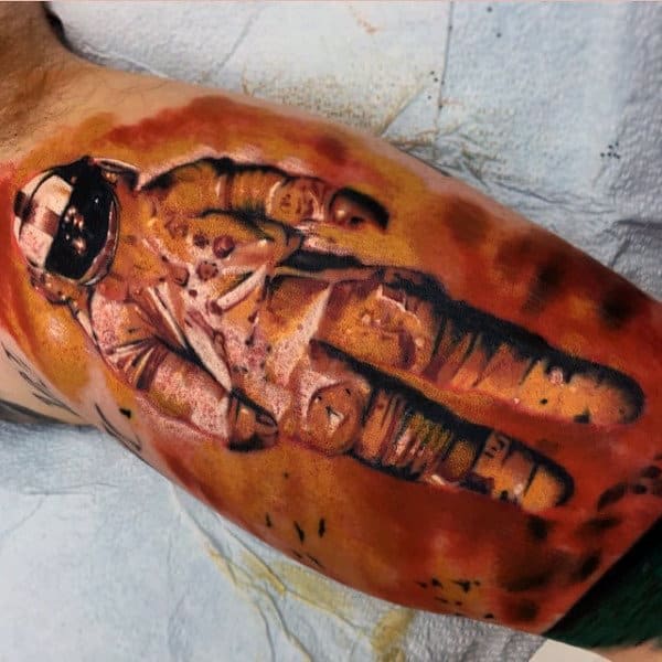 Mens Calves Bronze Colored Astronaut Tattoo