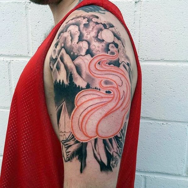 Half-sleeve tattoo with a red outlined campfire and swirling smoke, black and grey mountains, forest, tent, and dramatic night sky.