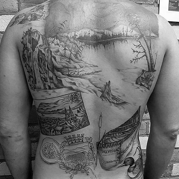 Alt text: Large black and grey tattoo covering the back, showcasing a variety of scenes, including a river, cliff, cityscape, and symbolic designs like a boat and crest.