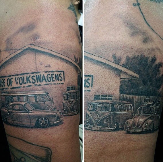 Tattoo of a garage with a sign "House of Volkswagens" and multiple vintage Volkswagen cars on an upper arm