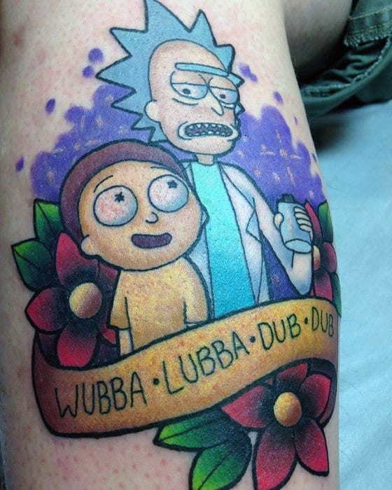 Vibrant tattoo of Rick and Morty surrounded by colorful flowers, with a banner that reads “WUBBA LUBBA DUB DUB” and a purple space-like background.