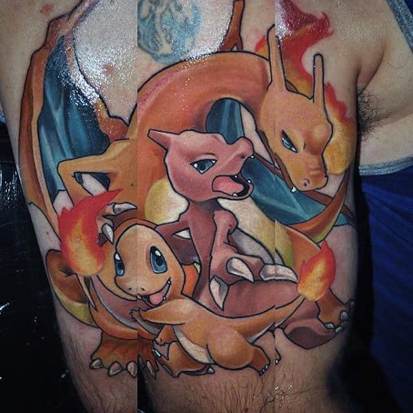 Bold chest and shoulder tattoo of Charmander, Charmeleon, and Charizard in a fiery trio pose, showcasing their evolution with vivid flames and dynamic shading.