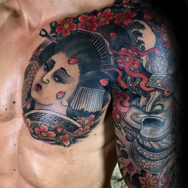 Japanese-style chest and sleeve tattoo featuring a detailed geisha, fierce samurai mask, flowing red ribbons, and vibrant cherry blossoms
