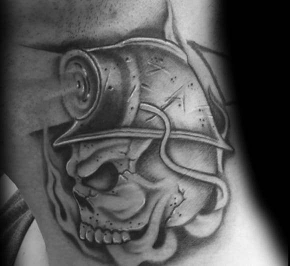 Black and grey tattoo of a skull wearing a miner's helmet with a headlamp and cable, shaded for bold contrast.