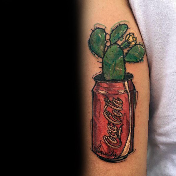 Creative Coca-Cola can tattoo featuring a cactus growing from it, with bold colors and fine details for a unique and artistic design.