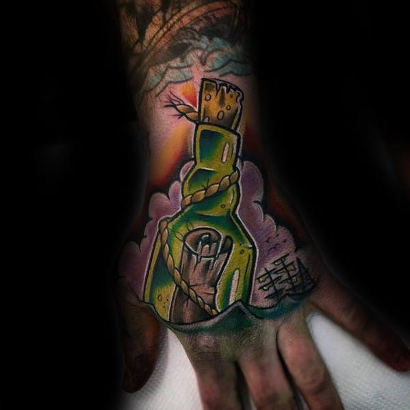 Vibrant tattoo of a green message in a bottle wrapped in rope, with a ship silhouette and colorful shading on the hand