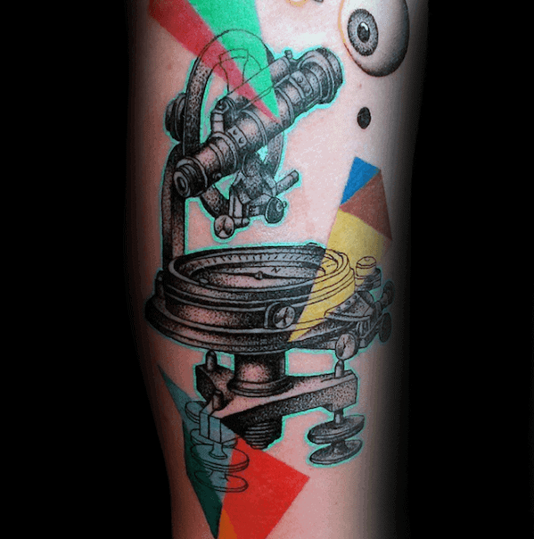 Telescope tattoo with geometric shapes on a forearm