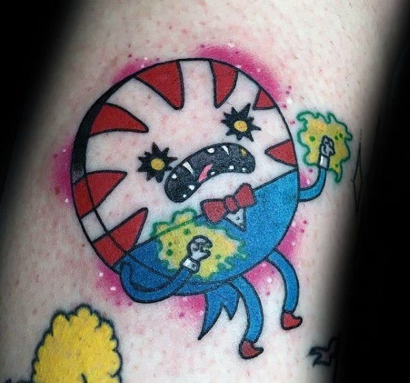 Adventure Time tattoo of Peppermint Butler in an angry expression holding magical green energy, with a pink aura, inked on the leg.