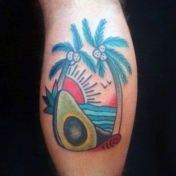 Tropical avocado tattoo with palm trees, ocean waves, and a sunset, blending beach vibes with colorful, playful elements.