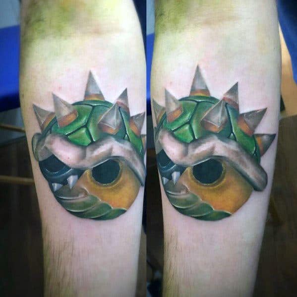 Realistic Bowser shell tattoo on a man's forearm featuring intricate shading, sharp spikes, and a 3D effect for a bold and striking design.