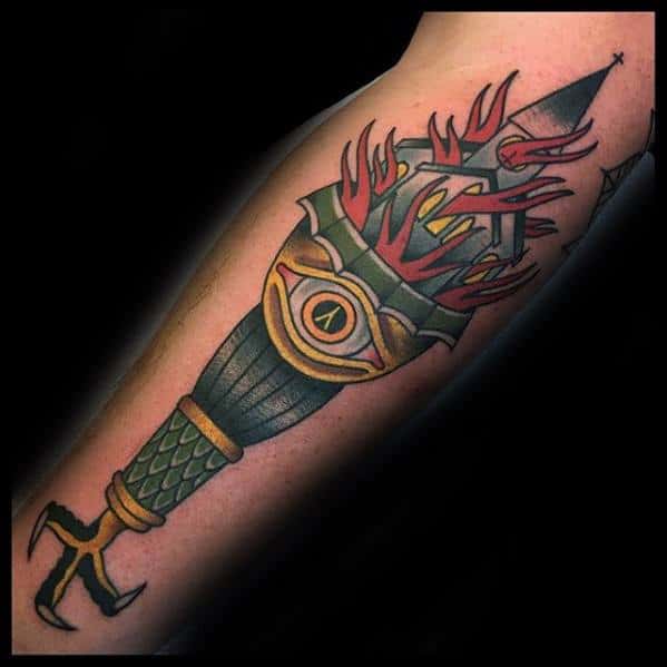 Traditional style tattoo of a burning church held in a clawed scepter. Features red flames, an all-seeing eye, and bold black outlines.