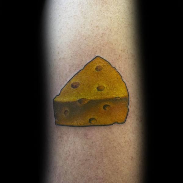 Simple tattoo of a wedge of Swiss cheese with bold black outlines and rich golden-yellow shading, creating a realistic yet minimalist design.