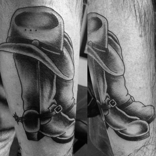 Black and white tattoo of a cowboy boot with a spur and a hat resting on top, symbolizing Western tradition, resilience, and cowboy spirit.