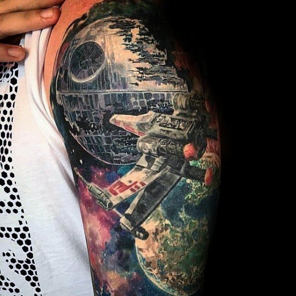 Vibrant Star Wars tattoo featuring the Death Star, an X-Wing fighter, and a colorful galactic scene
