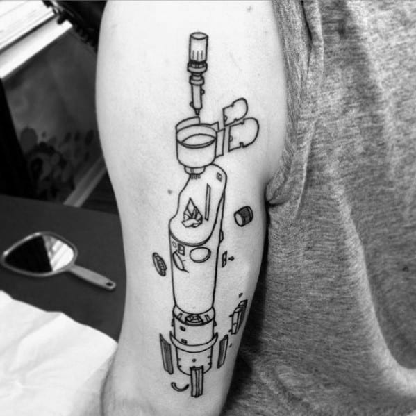 Tattoo of an exploded view of a futuristic device or weapon, with detailed floating components and a minimal line-art style on the upper arm.
