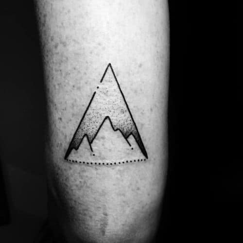 Minimal triangle mountain tattoo with dotwork shading and a dotted base line, creating a clean and modern design.