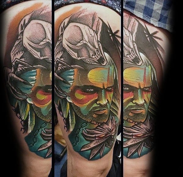 Geralt tattoo in a bold, colorful style with tribal-like face paint, a wolf skull, and his signature medallion, blending fantasy and abstract art.