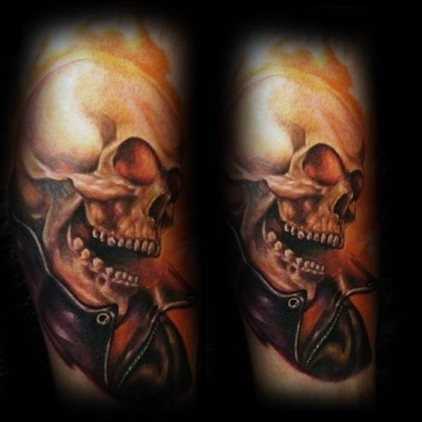 Ghost Rider tattoo with a realistic flaming skull in profile, leather jacket, and glowing orange tones creating a bold and intense look.