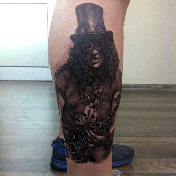 Realistic leg tattoo of Slash playing guitar, wearing his signature top hat and sunglasses, capturing his iconic Guns N' Roses style.