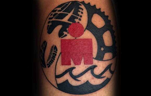 Ironman logo surrounded by waves, footprints, and bicycle gears, symbolizing the full triathlon with swimming, cycling, and running.