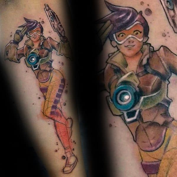 Colorful tattoo of Tracer from Overwatch in an action pose, featuring her signature goggles and chronal accelerator on the forearm.