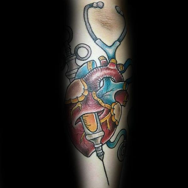 Colorful anatomical heart tattoo with a stethoscope and syringe, symbolizing passion for medicine, cardiology, and life-saving care.