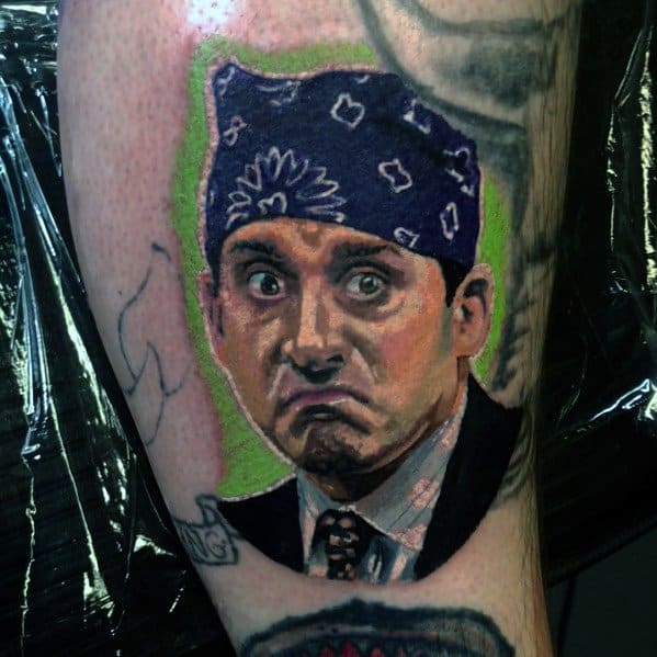 Color tattoo of Michael Scott as "Prison Mike" from *The Office*, featuring his iconic purple bandana and exaggerated facial expression.