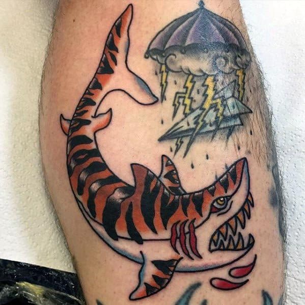 Fierce tiger shark tattoo with bold orange and black stripes, open jaws, blood drops, and a stormy lightning-filled sky above.