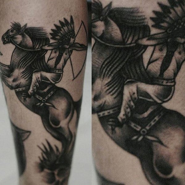Black and grey tattoo of a Native American warrior with a feathered headdress riding a rearing horse, detailed with bold shading.