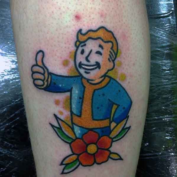 Vault Boy tattoo giving a thumbs-up with a red flower and green leaves below, set against a cheerful yellow dot background.