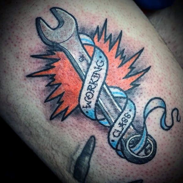 Tattoo of a wrench wrapped in a blue and white banner that reads WORKING CLASS, set against an orange starburst background.