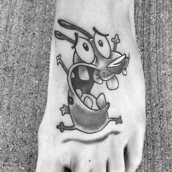 Black and grey tattoo of a screaming Courage the Cowardly Dog with exaggerated eyes and mouth, inked on the top of the foot.