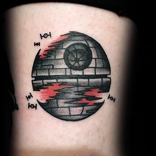 Stylized Death Star tattoo with red shading and TIE fighters, blending bold design with Star Wars flair