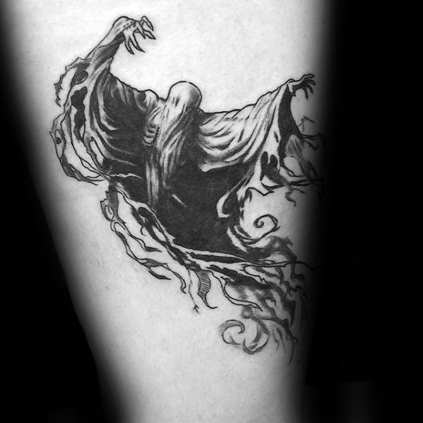 Black and grey tattoo of a Dementor with outstretched arms, flowing cloak, and swirling shadows in a dynamic mid-flight pose.