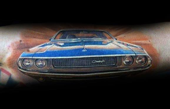 Realistic blue Dodge Challenger tattoo with a bold front view, detailed shading, and dynamic background for a powerful muscle car design.