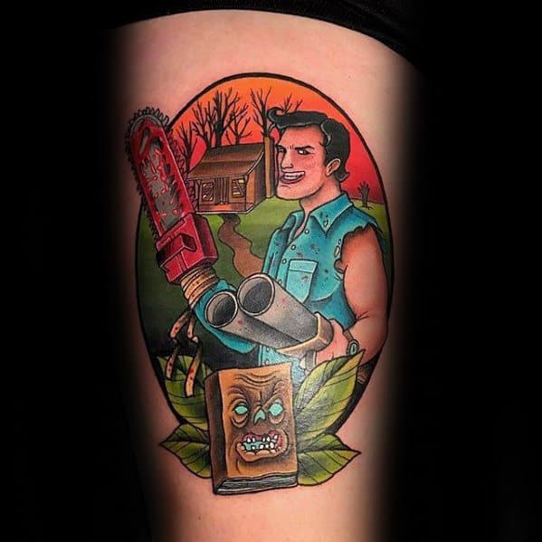 Bright and bold Evil Dead tattoo of a cartoon-style Ash with a chainsaw and shotgun, set in front of the cabin with the Necronomicon below